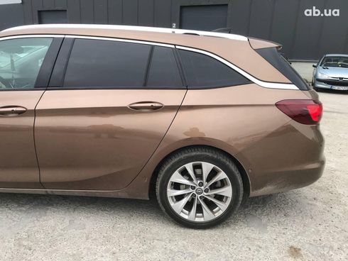 Opel Astra 2016 коричневый - фото 6