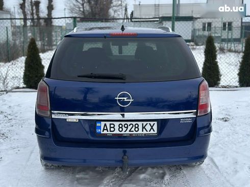Opel Astra 2010 - фото 14