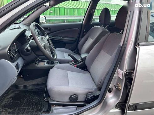 Nissan Almera 2004 - фото 9