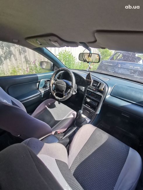 Mazda 323 1998 синий - фото 12