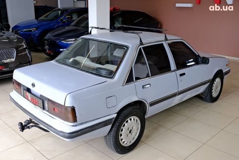 Isuzu Aska 1999 серый - фото 5
