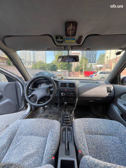 Nissan Almera 1998 серебристый - фото 3