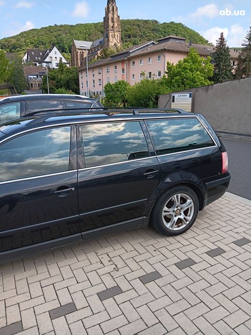 Volkswagen Passat 2004 черный - фото 17