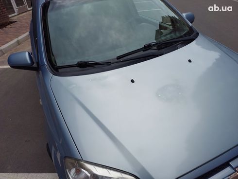 Chevrolet Aveo 2008 голубой - фото 5