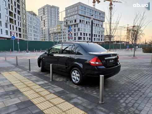 Nissan Tiida 2012 - фото 12