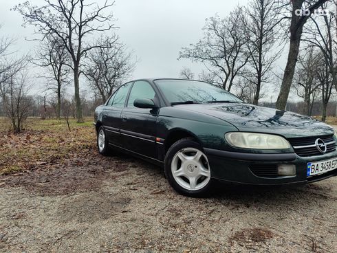 Opel Omega 1998 зеленый - фото 4