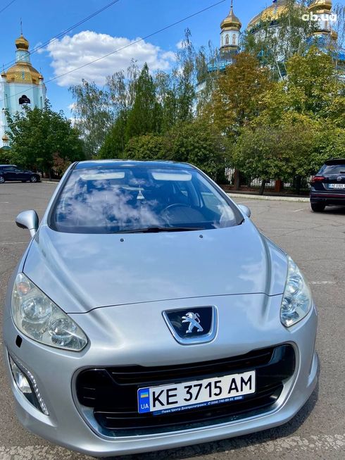 Peugeot 308 2011 серебристый - фото 4