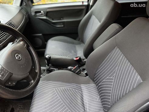 Opel Meriva 2006 черный - фото 25