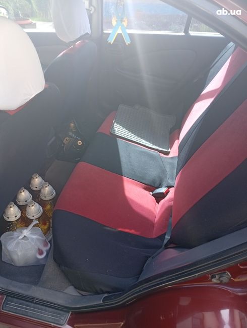 Nissan Almera 2004 вишневый - фото 4