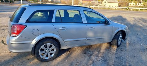 Opel Astra 2009 серебристый - фото 15