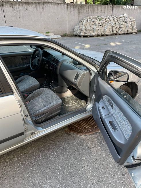Nissan Almera 1998 серебристый - фото 2