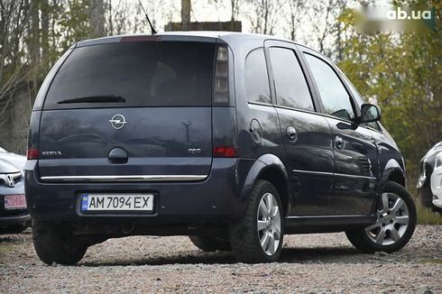 Opel Meriva 2009 - фото 13
