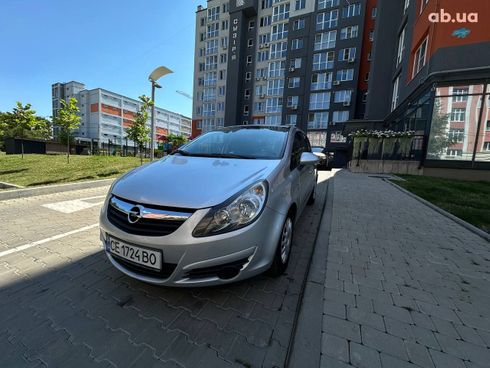 Opel Corsa 2011 серебристый - фото 7