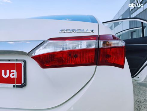 Toyota Corolla 2014 белый - фото 16