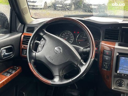 Nissan Patrol 2009 серый - фото 37