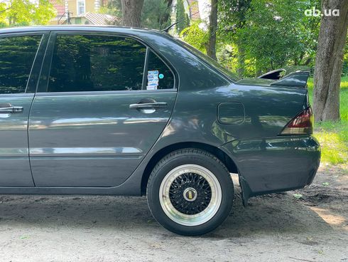Mitsubishi Lancer 2003 черный - фото 10