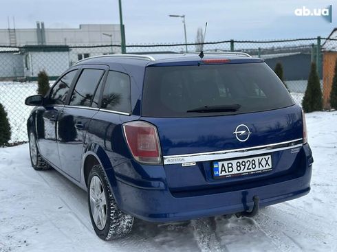 Opel Astra 2010 - фото 16
