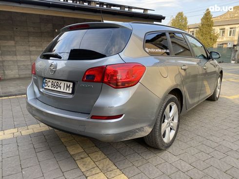 Opel Astra J 2011 серый - фото 8