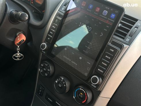 Toyota Corolla 2009 красный - фото 50