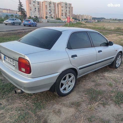 Suzuki Baleno 1995 серебристый - фото 2