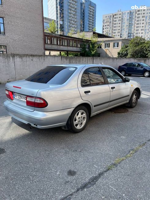 Nissan Almera 1998 серебристый - фото 11