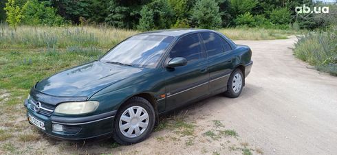 Opel Omega 1994 зеленый - фото 8