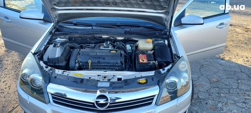 Opel Astra 2009 серебристый - фото 8