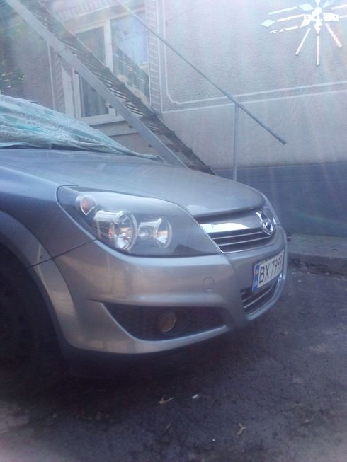 Opel Astra 2010 серебристый - фото 8