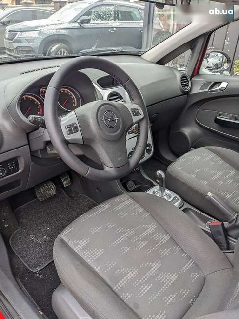 Opel Corsa 2012 - фото 13