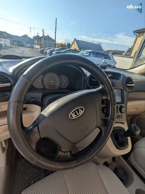 Kia Carens 2007 - фото 12