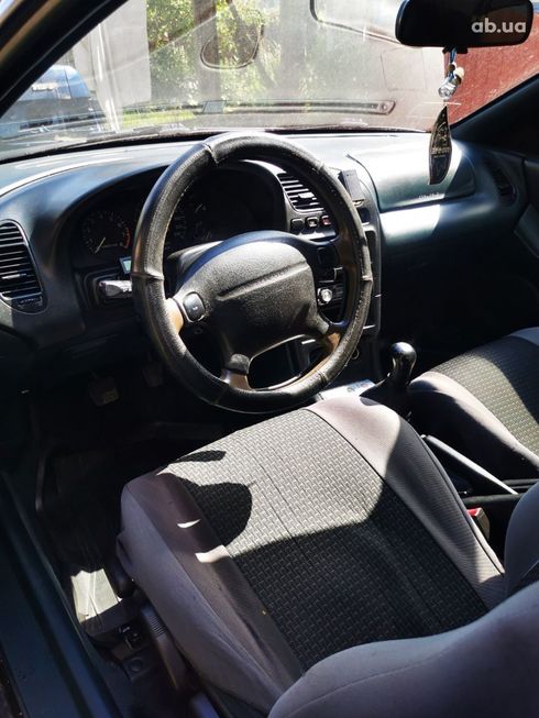 Mazda 323 1998 синий - фото 15