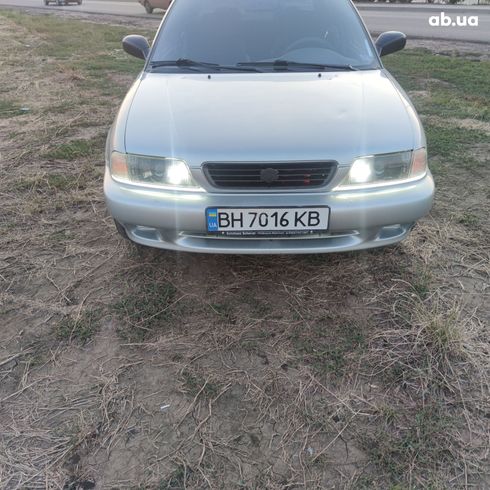 Suzuki Baleno 1995 серебристый - фото 4