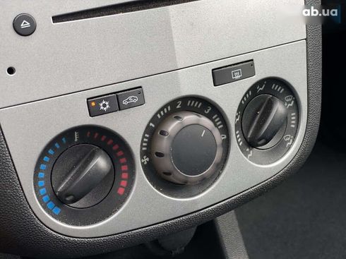 Opel Corsa 2011 - фото 14
