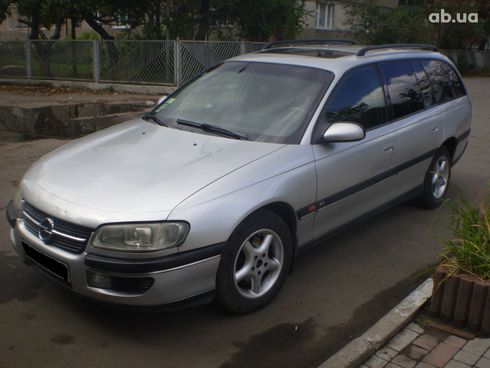Opel Omega 1998 серебристый - фото 2