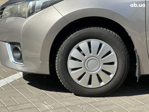 Toyota Corolla 2013 коричневый - фото 10