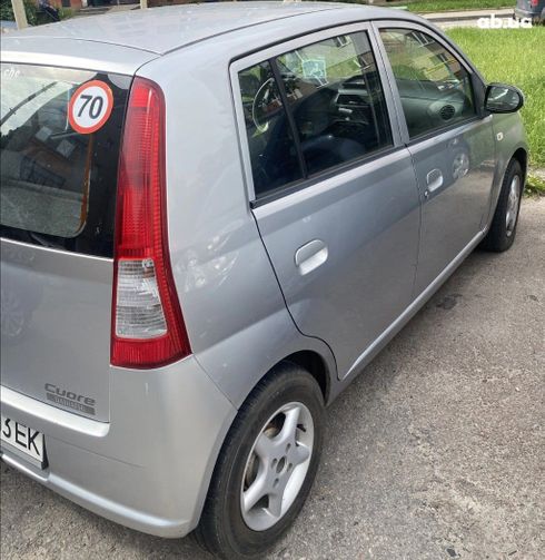 Daihatsu Cuore 2005 серебристый - фото 2