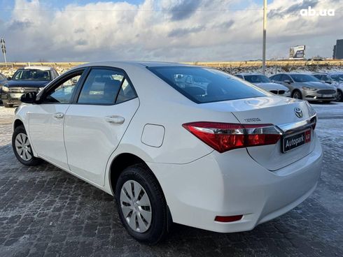 Toyota Corolla 2014 белый - фото 10