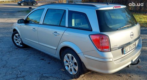 Opel Astra 2009 серебристый - фото 6
