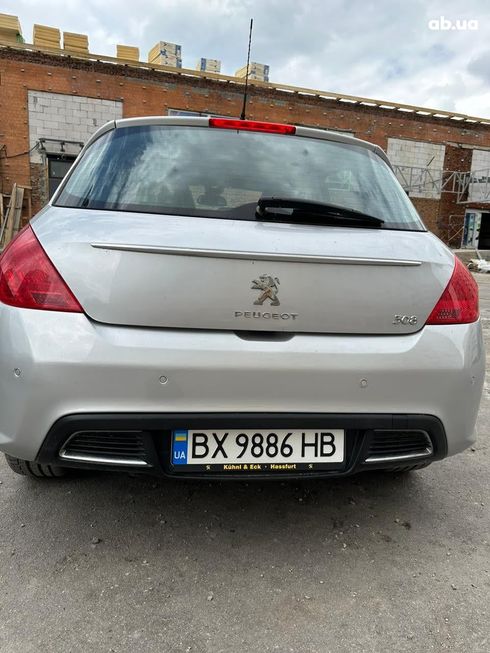 Peugeot 308 2011 серебристый - фото 7