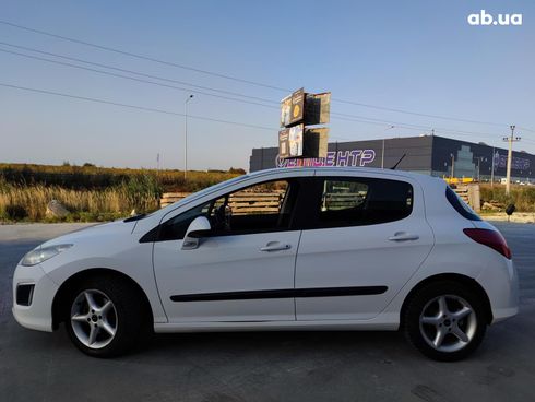 Peugeot 308 2011 белый - фото 9