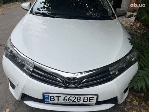 Toyota Corolla 2015 белый - фото 13