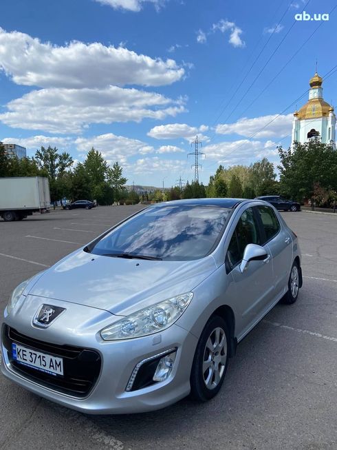 Peugeot 308 2011 серебристый - фото 14