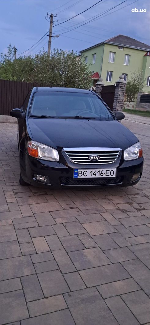 Kia Cerato 2007 черный - фото 7