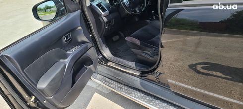 Mitsubishi Outlander XL 2011 черный - фото 12