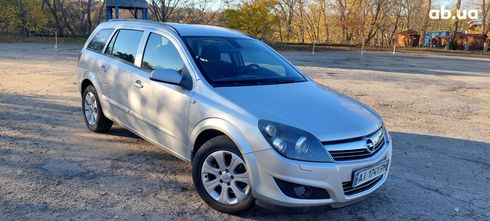 Opel Astra 2009 серебристый - фото 13