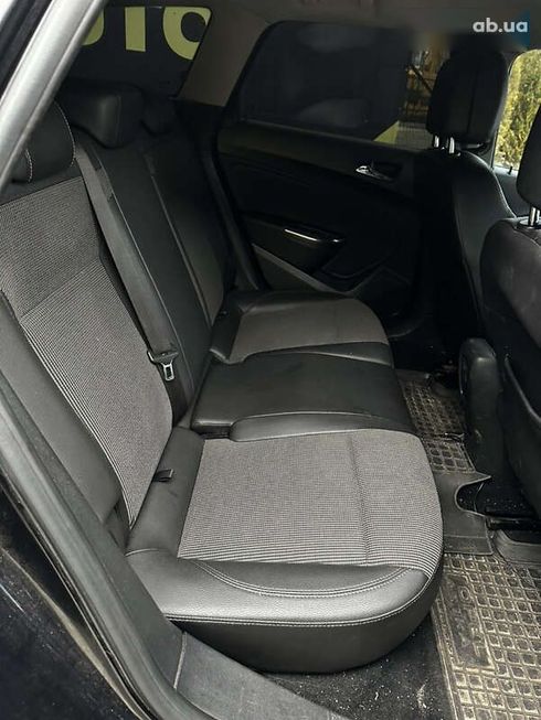 Opel Astra 2011 - фото 11