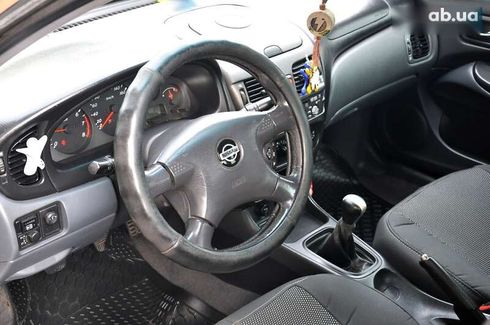 Nissan Almera 2004 - фото 17