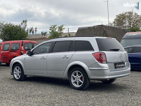 Opel Astra 2010 - фото 25