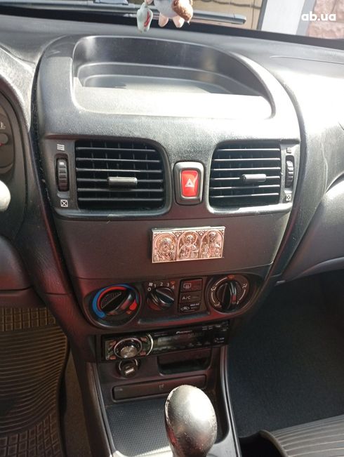 Nissan Almera 2004 вишневый - фото 10