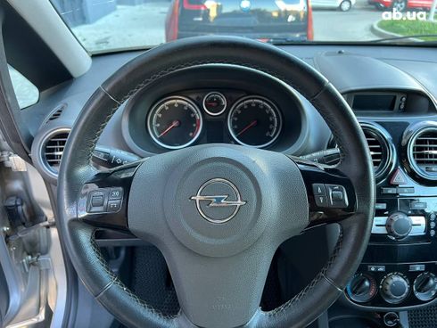 Opel Corsa 2011 серебристый - фото 10